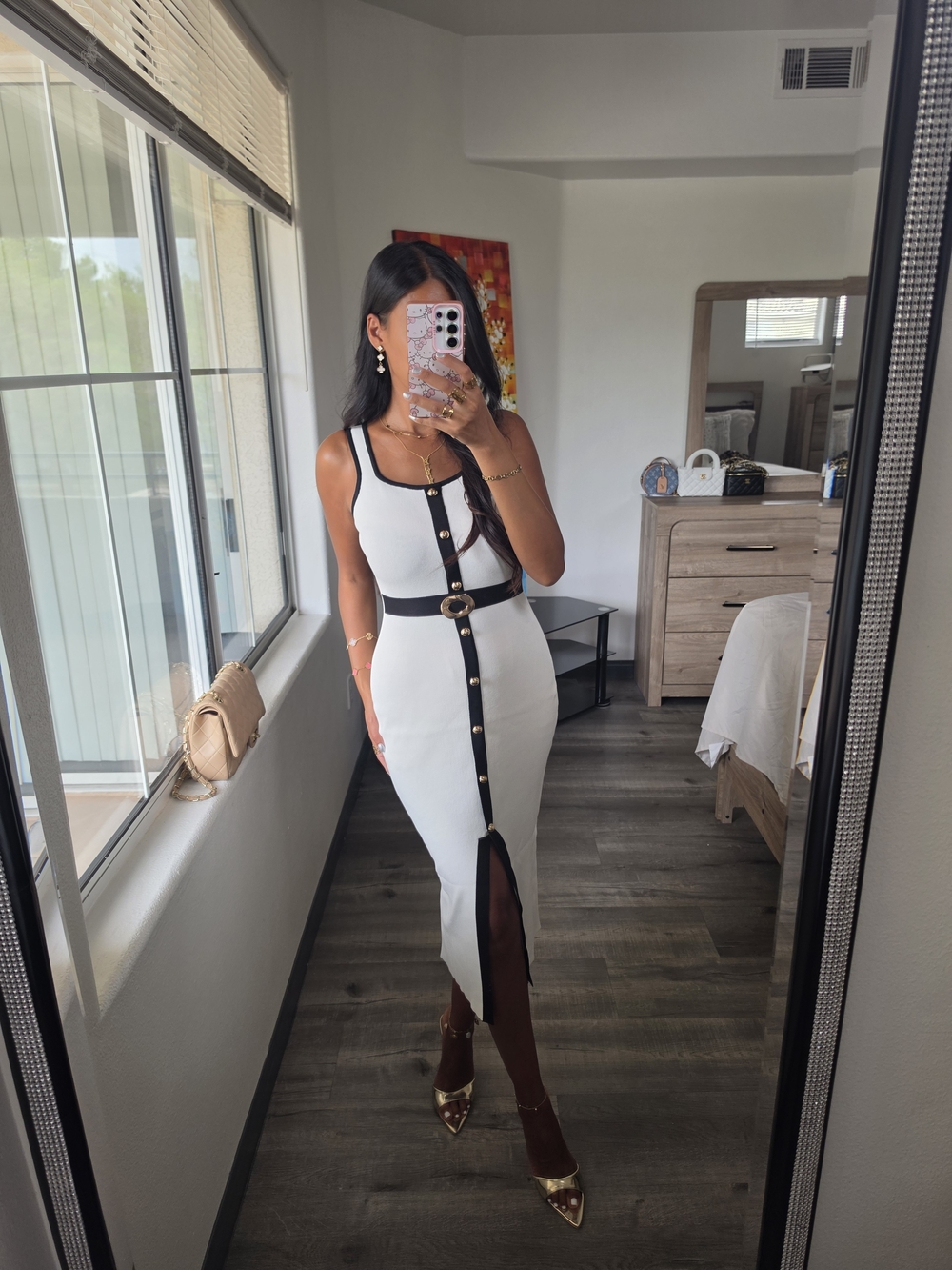 Sleek White Midi Dress with Black Trim and Gold Accent